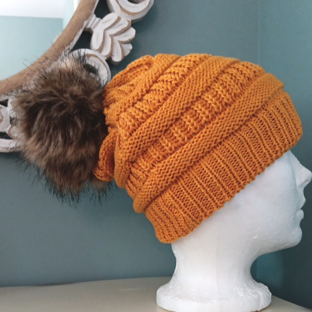 ^ David and Young Gold Knit Toque w Faux Fur Pom